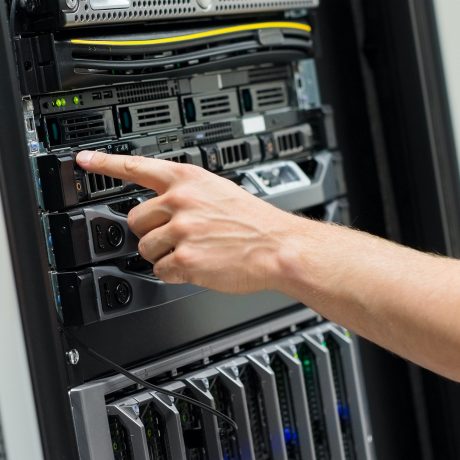Close-up of IT Engineer Switching On Server At Datacenter